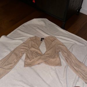 Cute fall sweater with an open back, ties into a bow!